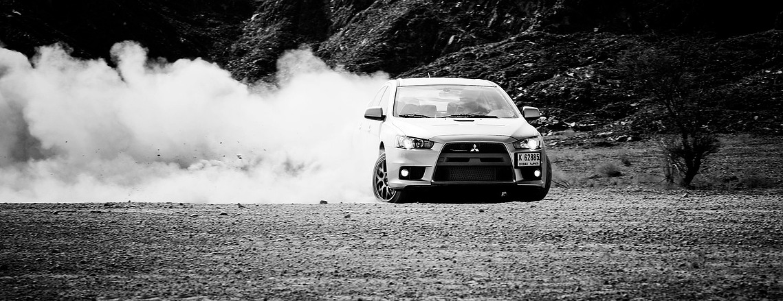 Unleash the power of the Mitsubishi Lancer Evolution in this dynamic rally shot. A perfect blend of precision and performance captured for motorsport and automotive enthusiasts
