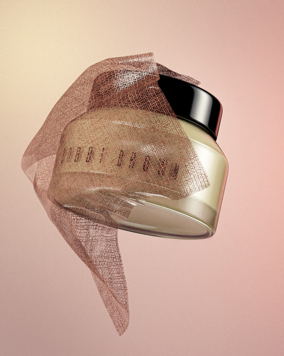 Made with CGI. A Bobbi Brown beauty foundation flying into a piece of fabric