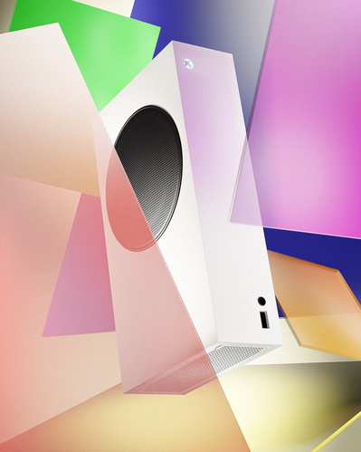 Made with CGI. An XBOX 360 hovering surrounded by floating colours glass shards. 