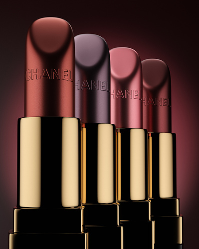 Made with CGI. Four Dior lipsticks standing in a row. 