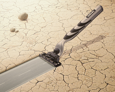 Made with CGI and Photography. A Gillette razor cutting through the rocky ground to make a new smooth road. 