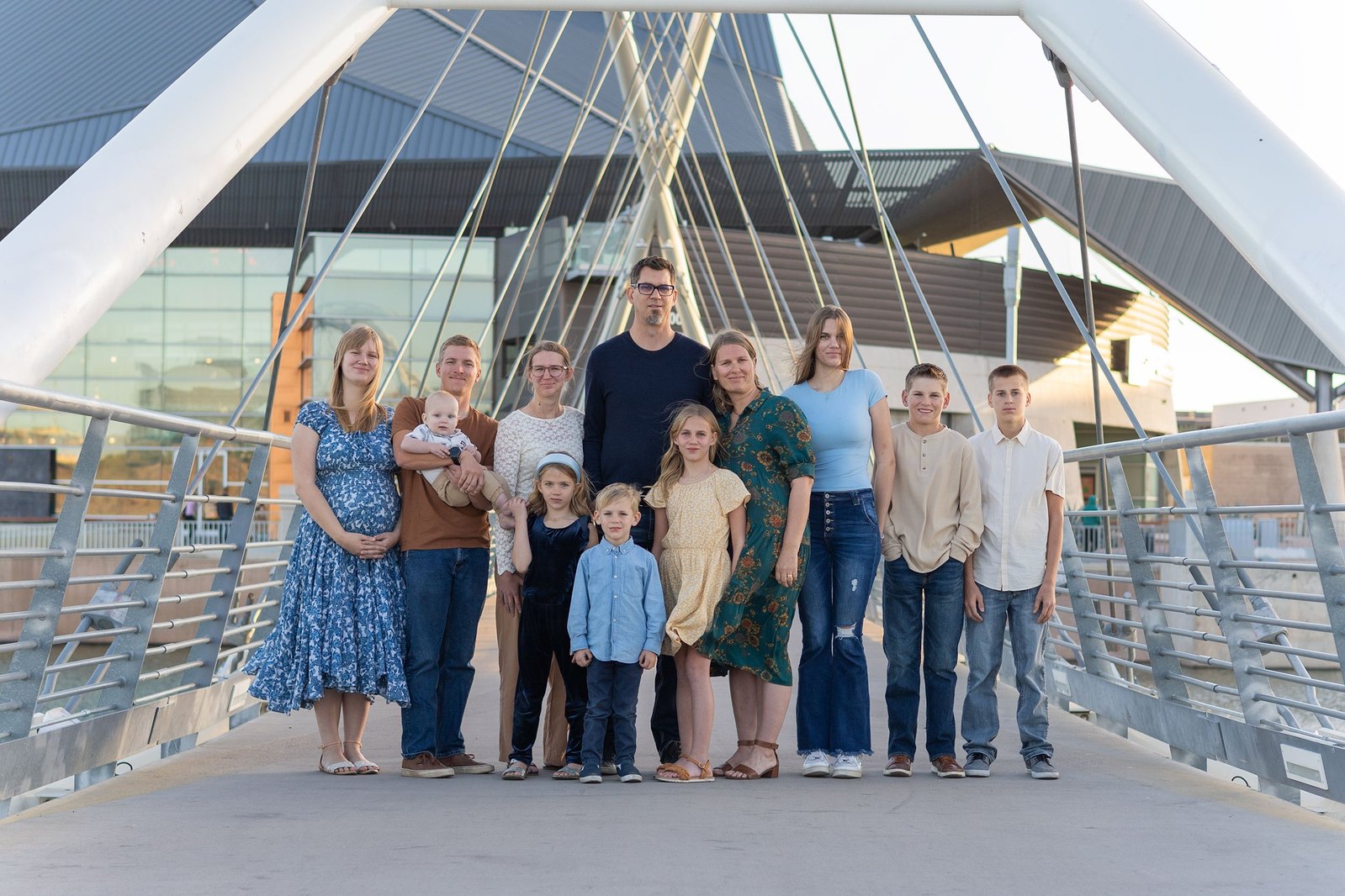 An extended family photo session taken on a bridge by The Lens Lady.