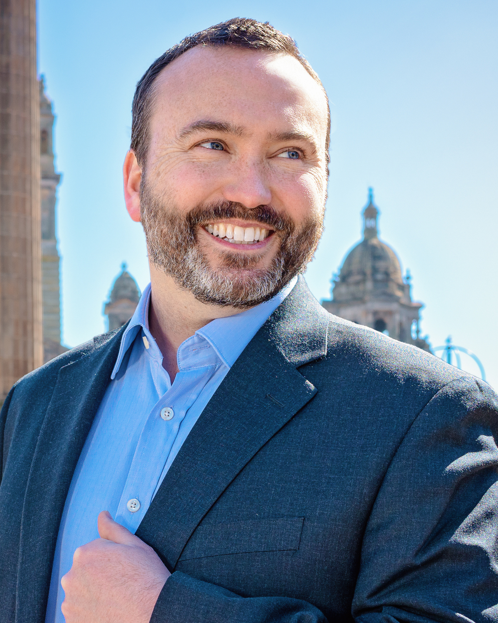 Scotland client posing for outdoor headshots at George Square - Photography by Nate Cleary