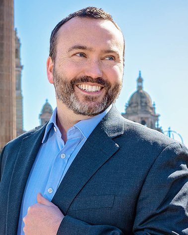 Scotland client posing for corporate headshots from TAB The Alternative Board at George Square - Photography by Nate Cleary