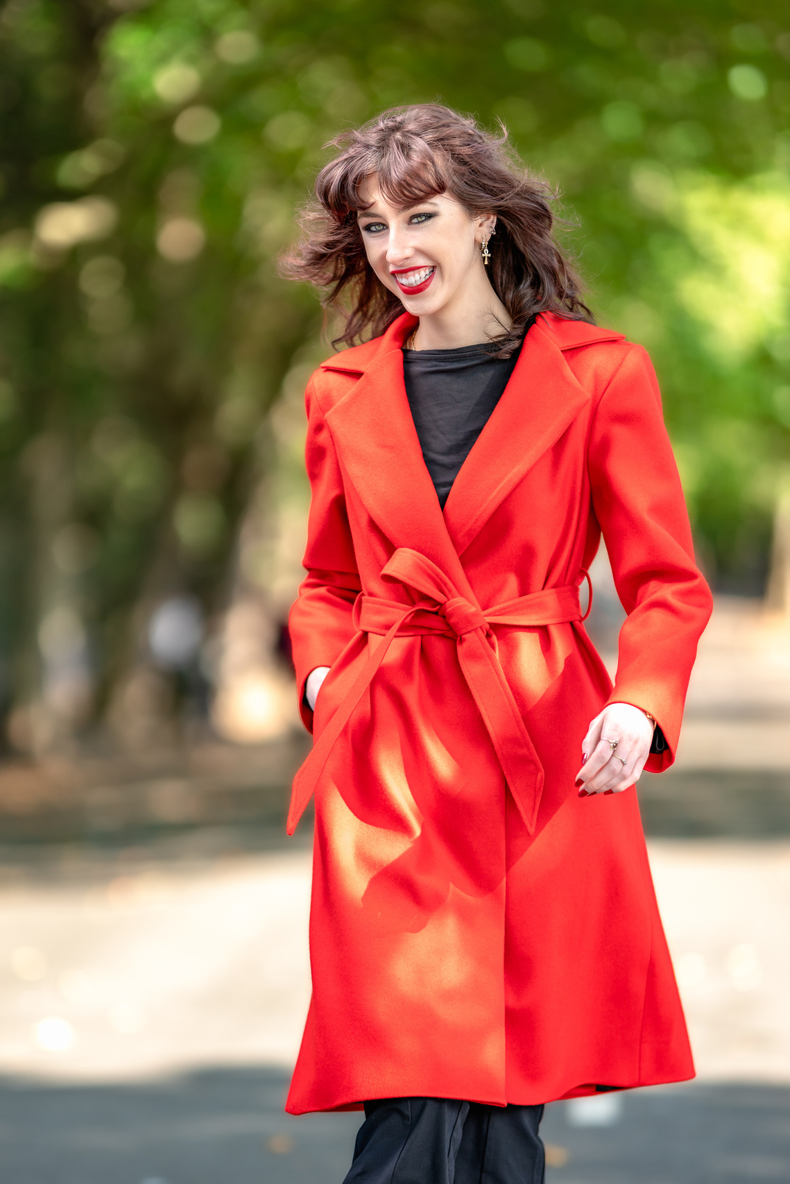 Woman poses while walking through Kelvingrove Park for fashion photoshoot for SIIO Designs