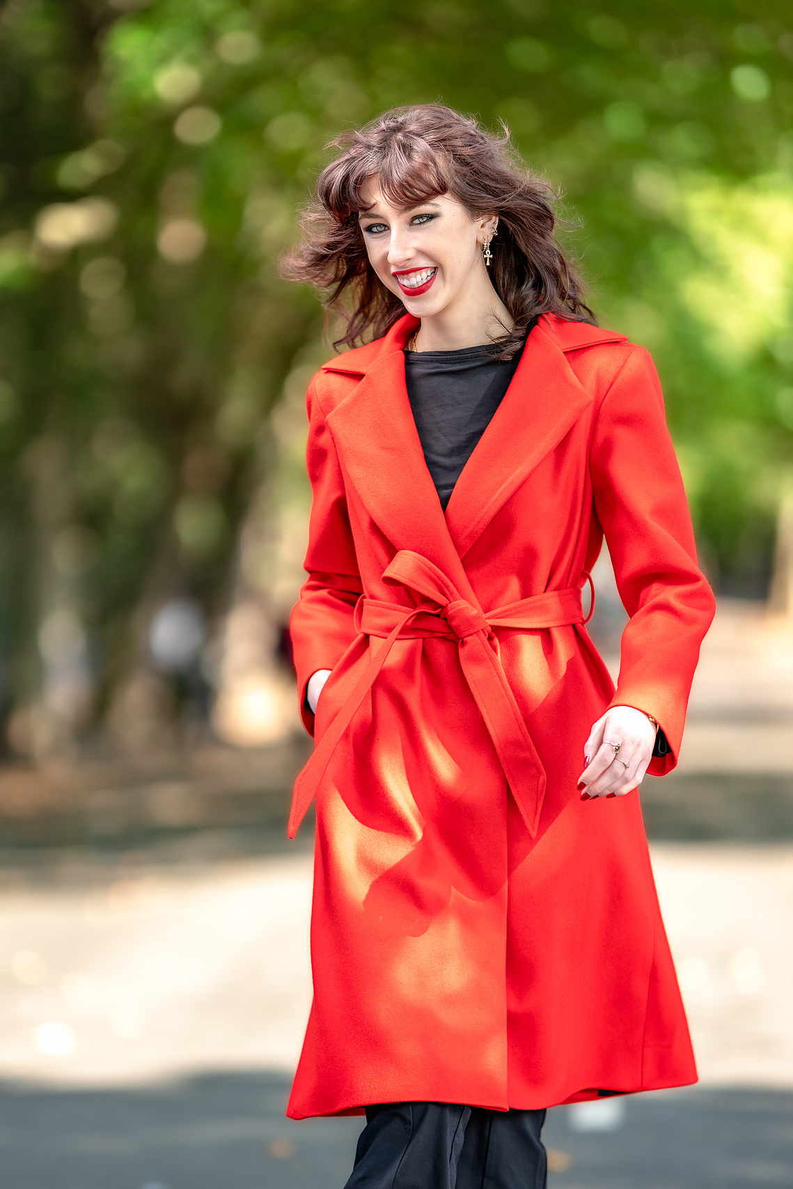 Woman poses while walking through Kelvingrove Park for fashion photoshoot for SIIO Designs