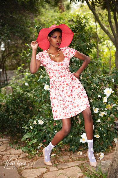 Top Glasgow model poses for clothing line in a garden for best Scotland commercial photographer at fashion photoshoot - Photography by Nate Cleary