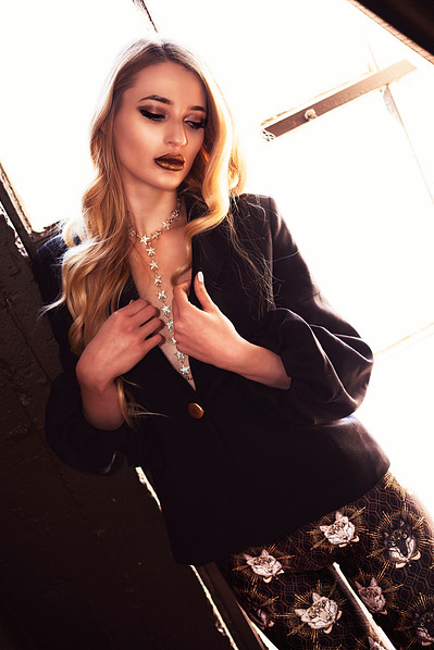 Top Scotland model poses for clothing line in a studio for best Glasgow commercial photographer at fashion photoshoot - Photography by Nate Cleary