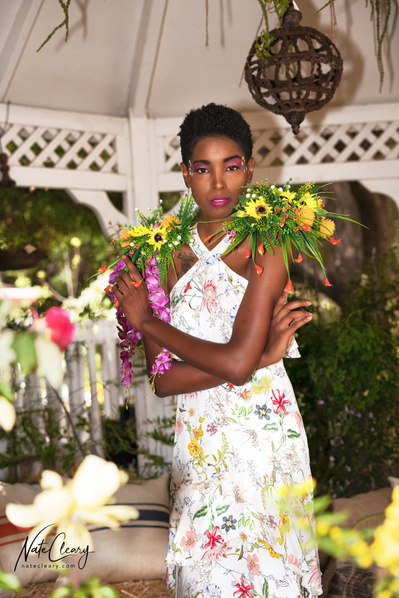 Top Glasgow model poses for clothing line in a garden for best Scotland commercial photographer at fashion photoshoot - Photography by Nate Cleary