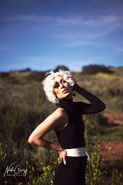 Best Glasgow model poses for creative clothing brand in a field for Scotland top fashion photographer at commercial photoshoot - Photography by Nate Cleary