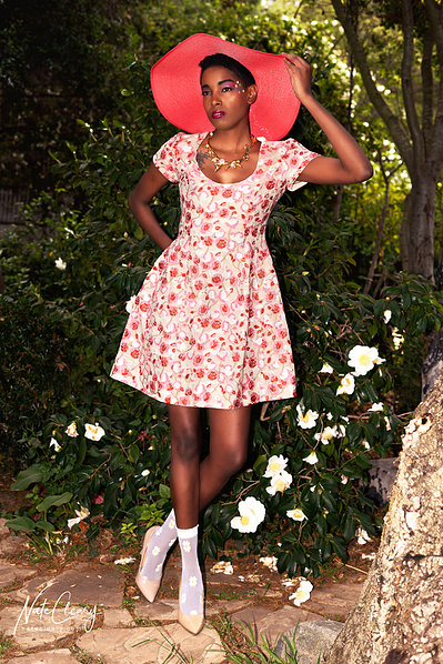 Top Glasgow model poses for clothing line in a garden for best Scotland commercial photographer at fashion photoshoot - Photography by Nate Cleary