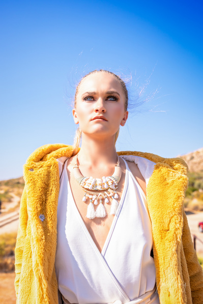 Top agency model in Glasgow poses for clothing line in desert for best Scotland commercial photographer in fashion photo shoot - Photography by Nate Cleary