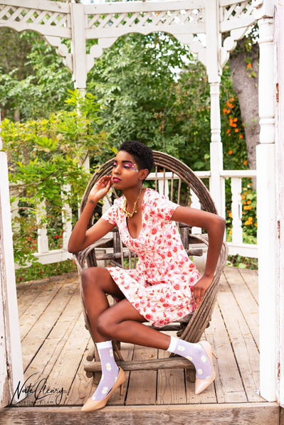 Top Glasgow model poses for clothing line in a garden for best Scotland commercial photographer at fashion photoshoot - Photography by Nate Cleary