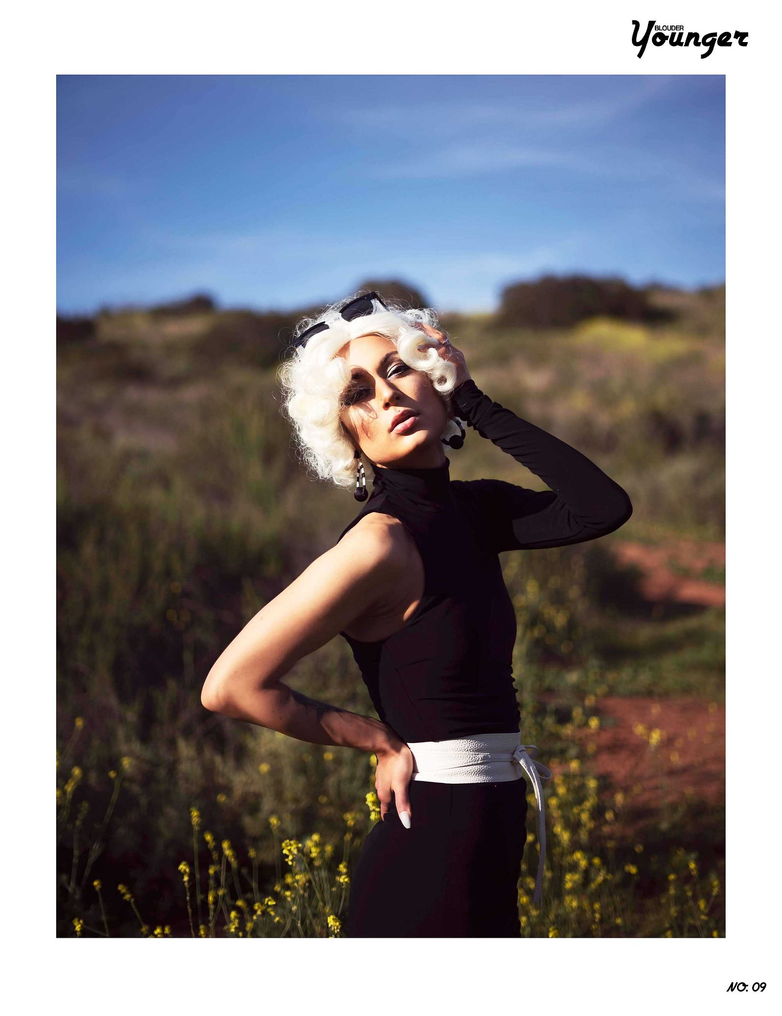 Best model in Scotland poses in a field for top Glasgow commercial fashion photographer for clothing line in magazine photo shoot - Photography by Nate Cleary