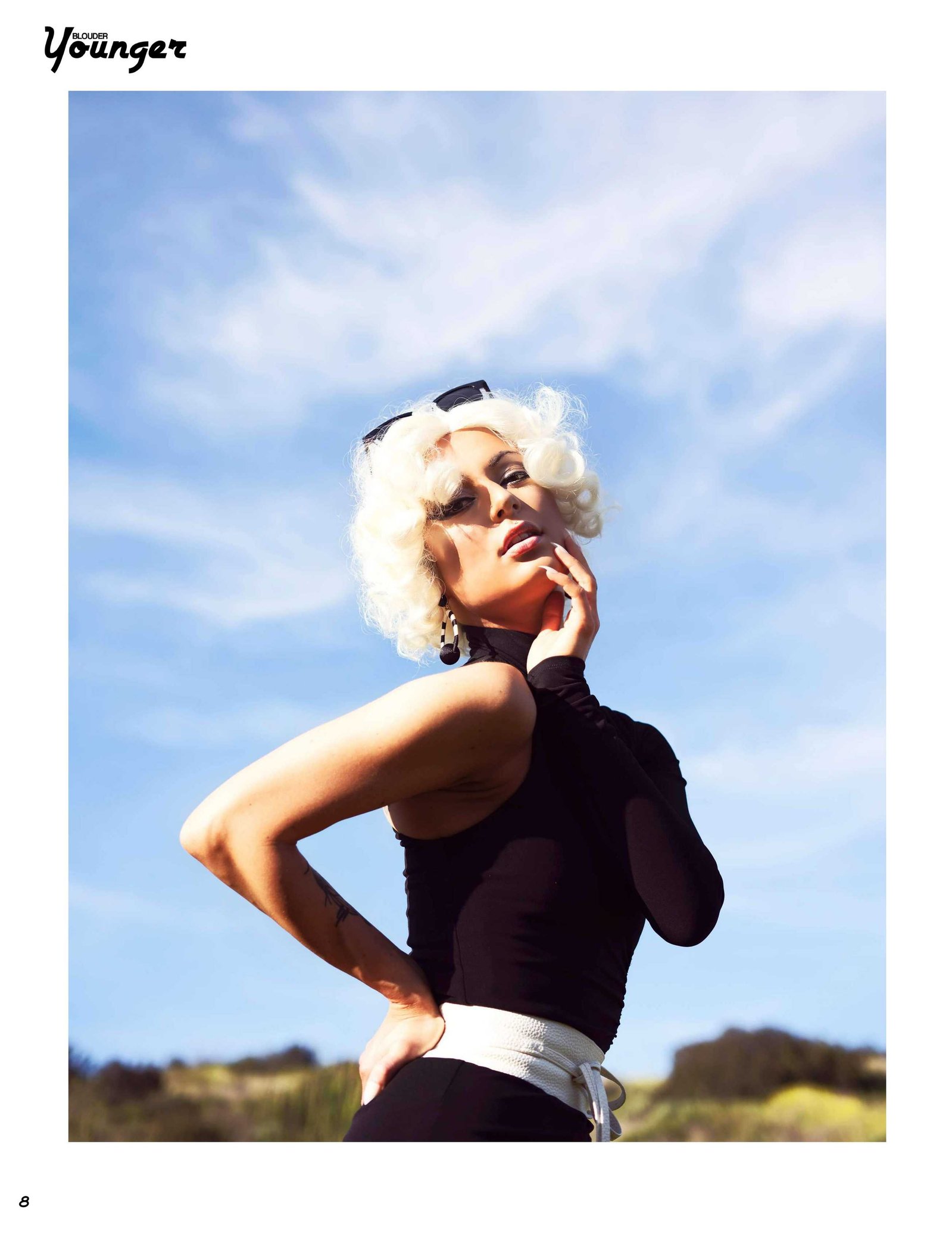 Best model in Scotland poses in a field for top Glasgow commercial fashion photographer for clothing line in magazine photo shoot - Photography by Nate Cleary