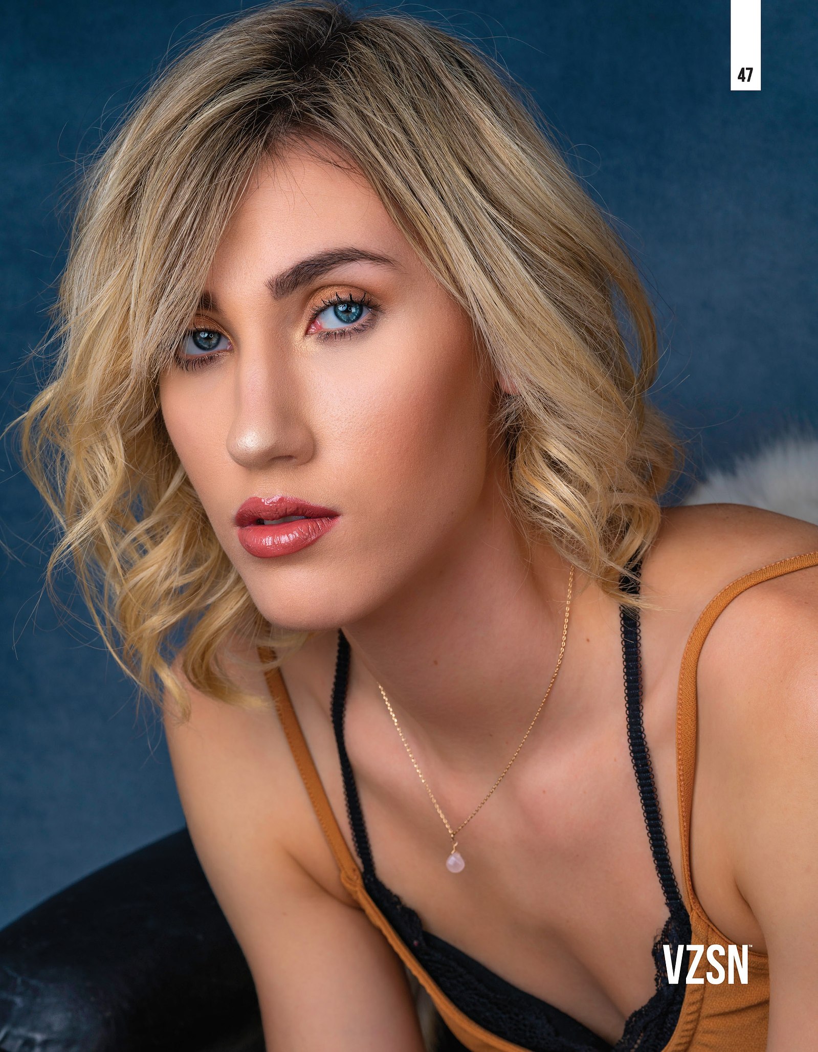 Top model in Glasgow poses in studio for best Scotland commercial fashion photographer for clothing line in magazine photo shoot - Photography by Nate Cleary