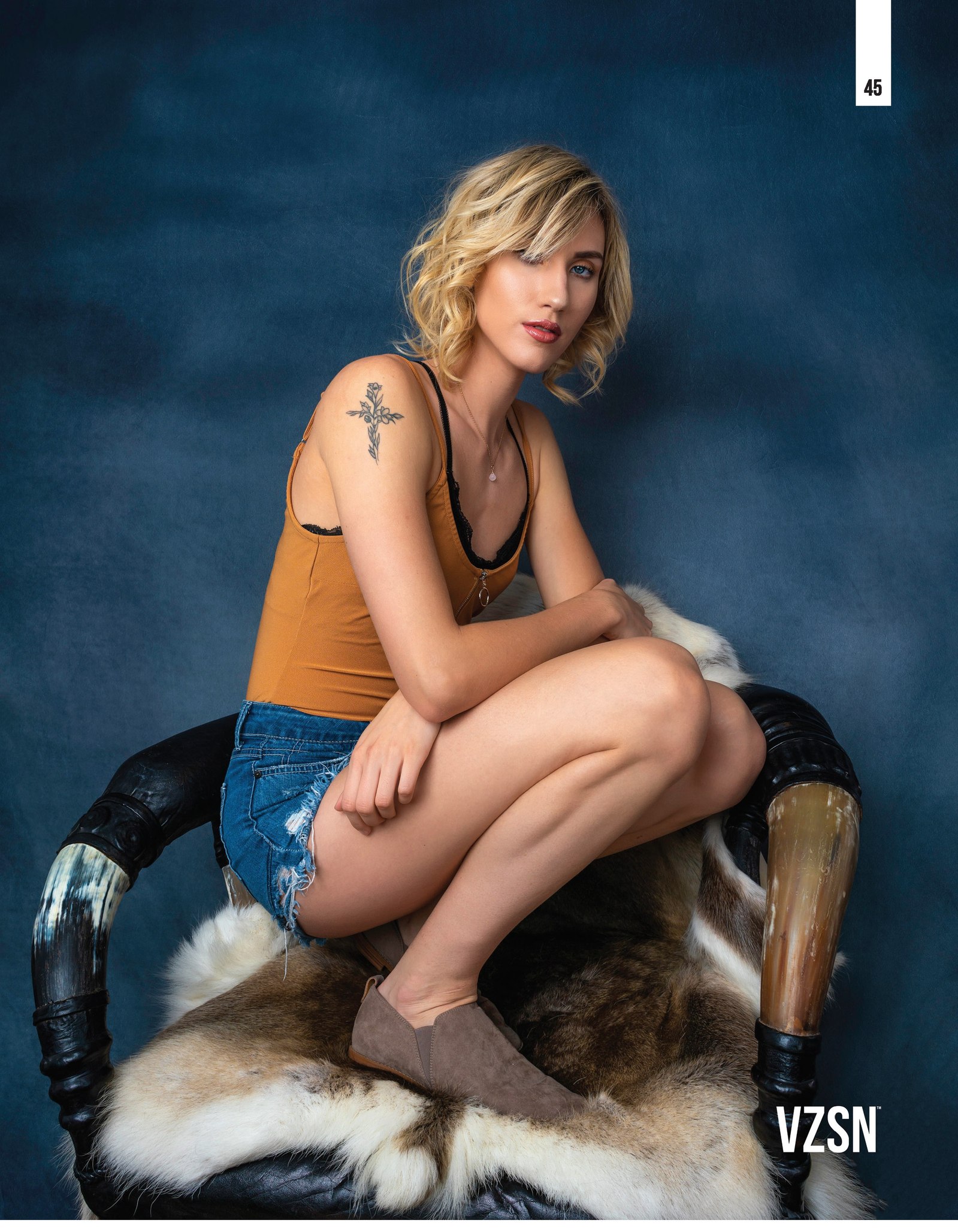 Top model in Glasgow poses in studio for best Scotland commercial fashion photographer for clothing line in magazine photo shoot - Photography by Nate Cleary