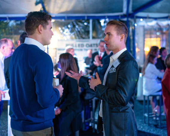 Guests chatting at diplomatic event for Consul General of Finland - Photography by Nate Cleary