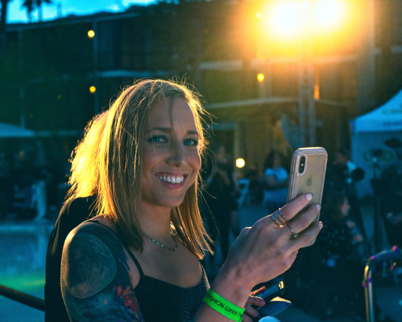 Guest taking photos of model on runway during Palm Springs Fashion Week- Photography by Nate Cleary