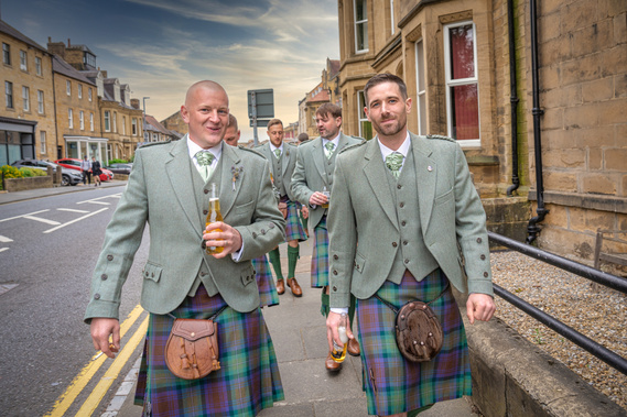 Groom and groomsmen walking to wedding event in Scotland- Photography by Nate Cleary