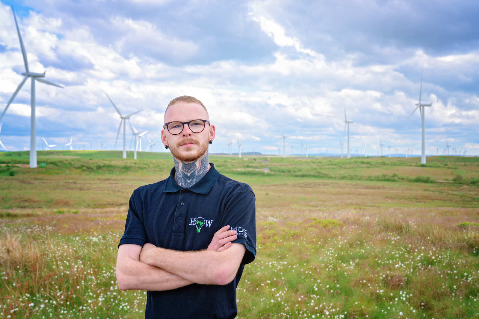 Scotland client posing for headshots from EnergyHow UK at Whitelee Windfarm - Photography by Nate Cleary