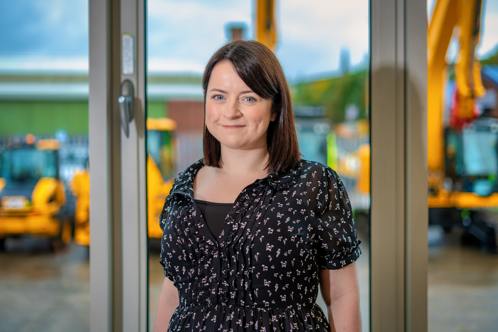 Scotland client posing for headshots from Scot JCB at Glasgow - Photography by Nate Cleary