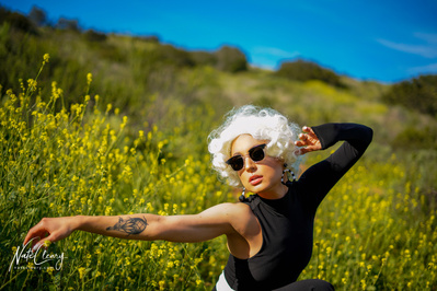 Best Glasgow model poses for creative clothing brand in a field for Scotland top fashion photographer at commercial photoshoot - Photography by Nate Cleary