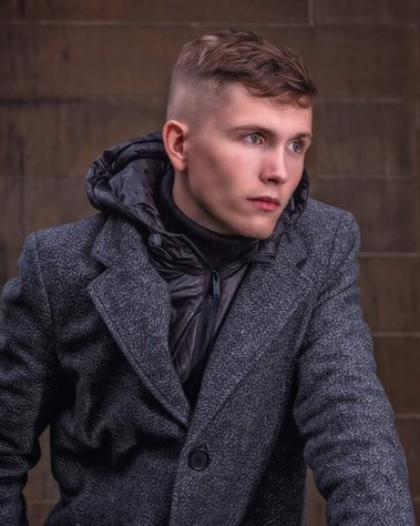 Graduate posing for Student Graduation headshot session at University of Glasgow - Photography by Nate Cleary