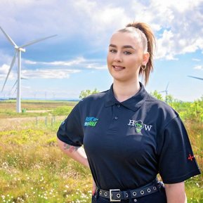 Scotland client posing for headshots from EnergyHow UK at Whitelee Windfarm - Photography by Nate Cleary