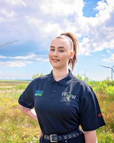 Scotland client posing for headshots from EnergyHow UK at Whitelee Windfarm - Photography by Nate Cleary