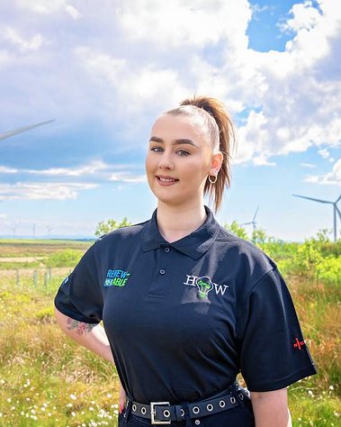 Scotland client posing for headshots from EnergyHow UK at Whitelee Windfarm - Photography by Nate Cleary