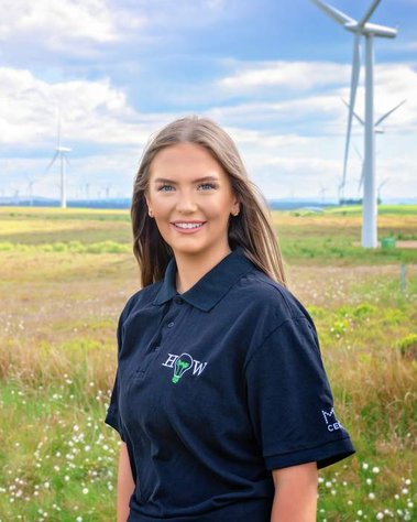 Scotland client posing for headshots from EnergyHow UK at Whitelee Windfarm - Photography by Nate Cleary