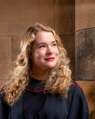 Graduate posing for Student Graduation headshot session at University of Glasgow - Photography by Nate Cleary