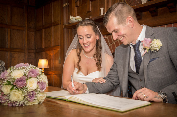 wedding photography, bride and groom, signing the register, wedding photographer