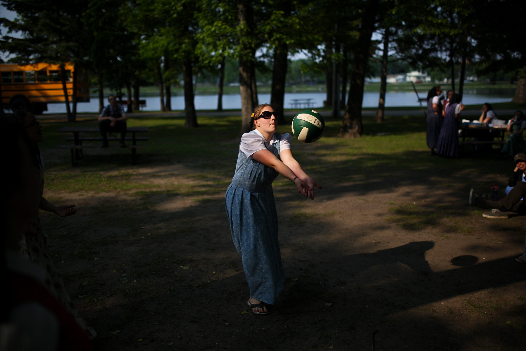 A Hutterite woman plays volleyball with friends.