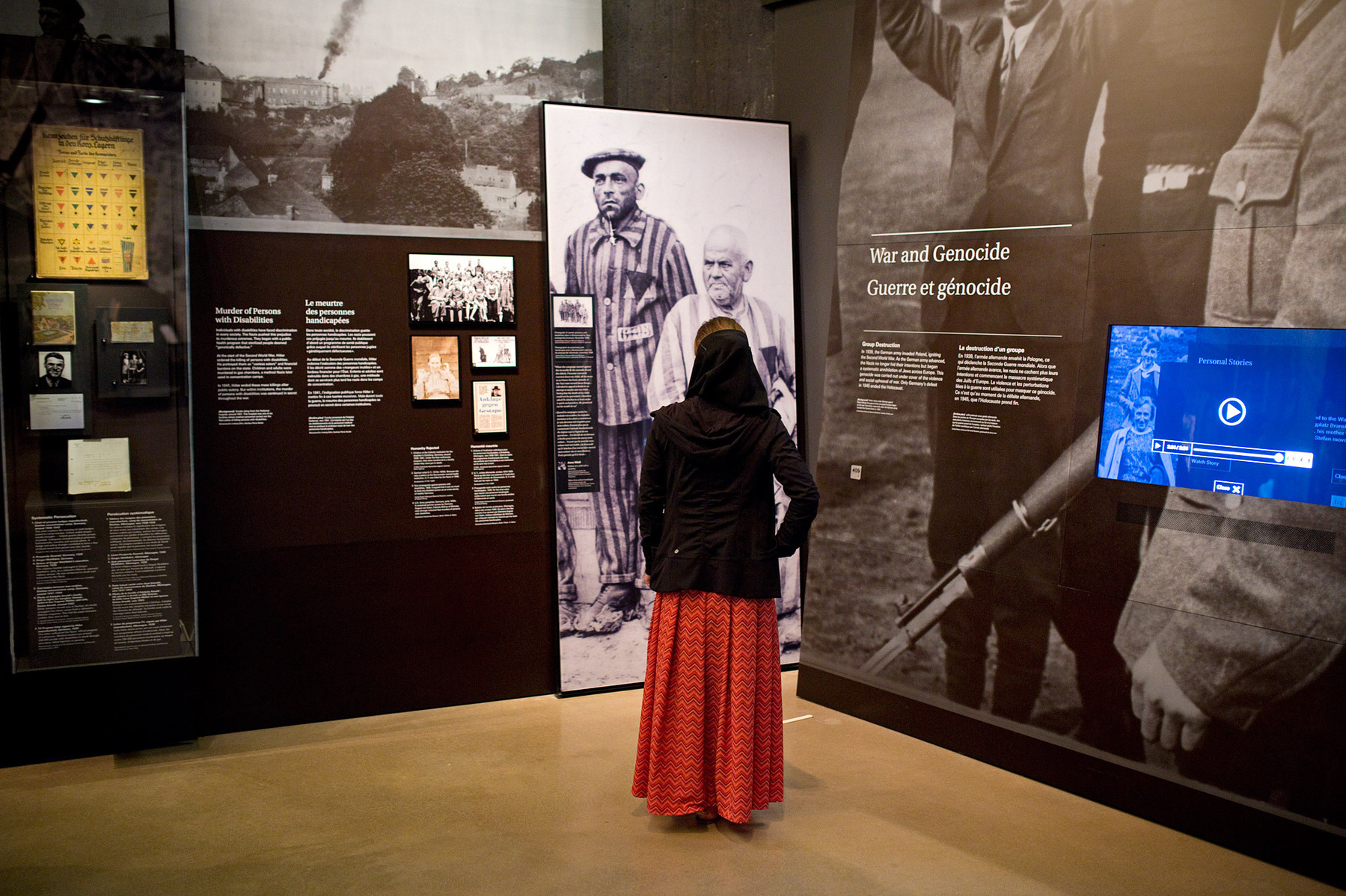 A Hutterite woman looks at an exhibit at the Canadian Museum for Human Rights in Winnipeg.