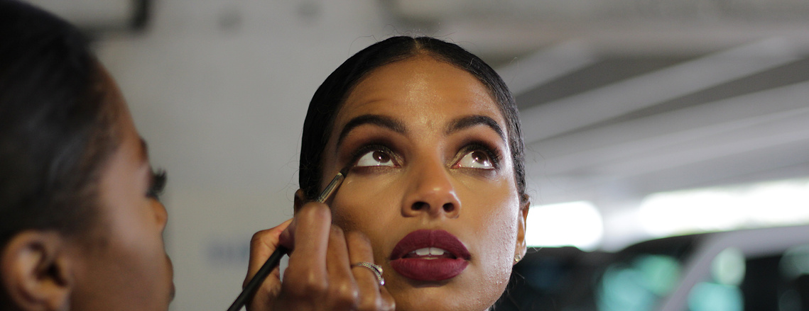 Behind the scenes makeup artist at work. 