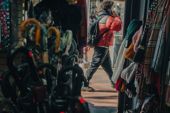 Customer walks by Yun Xiang Gift Shop
