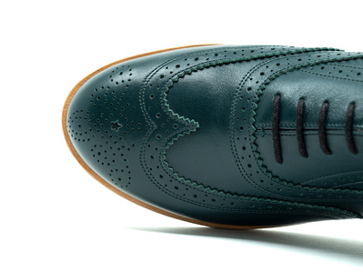 Coloured brogues, bespoke. Colour forest green. Leather soles. Handmade in the Netherlands by Annelieke van Halen. Handcrafted shoes
