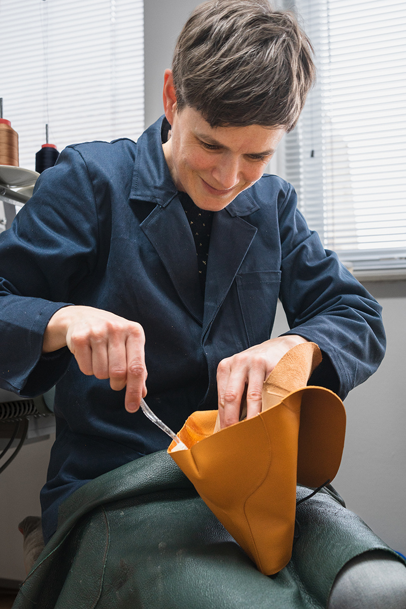 Artisan shoemaker Annelieke van Halen in her studio in Delft. Lasting the uppers of a pair of derby boots. Handmade shoes, made to last