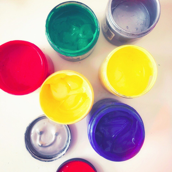 top view of acrylic ink pots in primary colours