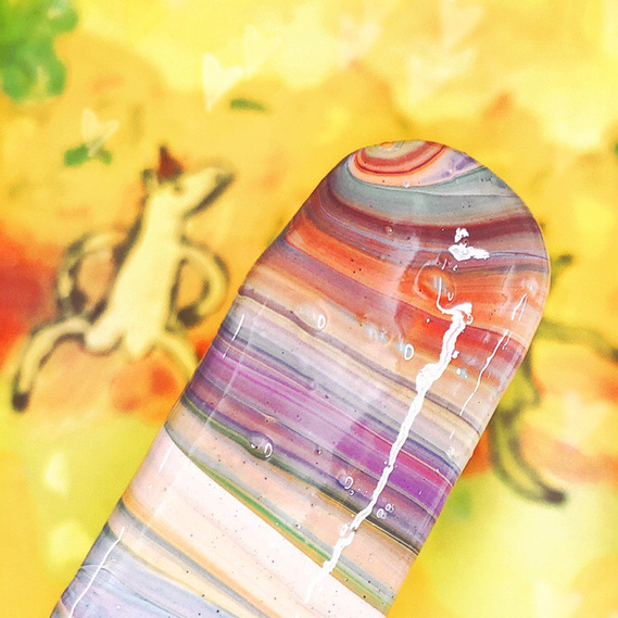 palette knife with swirly acrylic paint rainbow