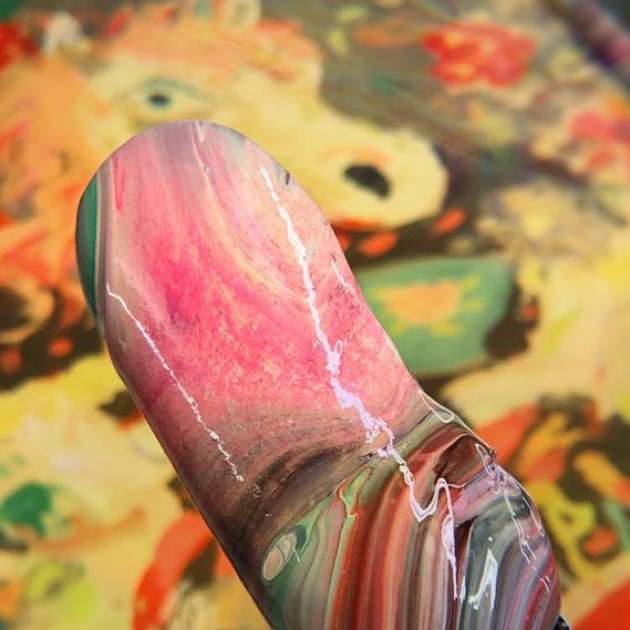 palette knife with swirly acrylic paint rainbow
