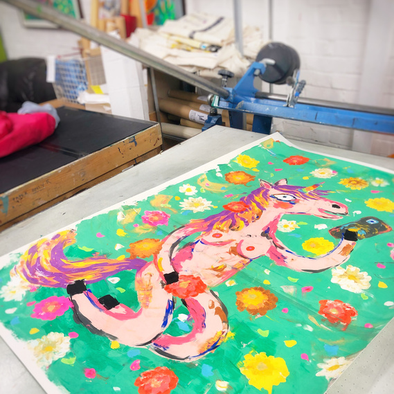 print studio shot of screen print painting of nude unicorn by lowbrow artist Fabi Santiago