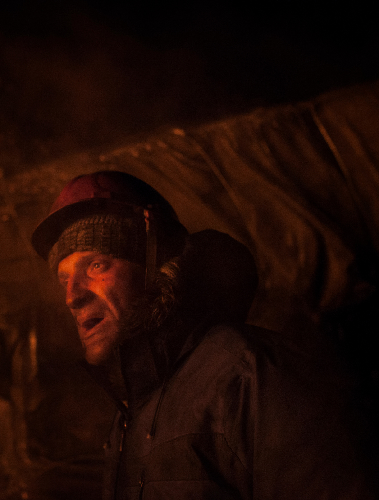 A protester watches as others fuel an ablaze barricade with tires during clashes between antigovernment protesters and riot police on Hrushevskoho street. Kiev, 24 January 2014.