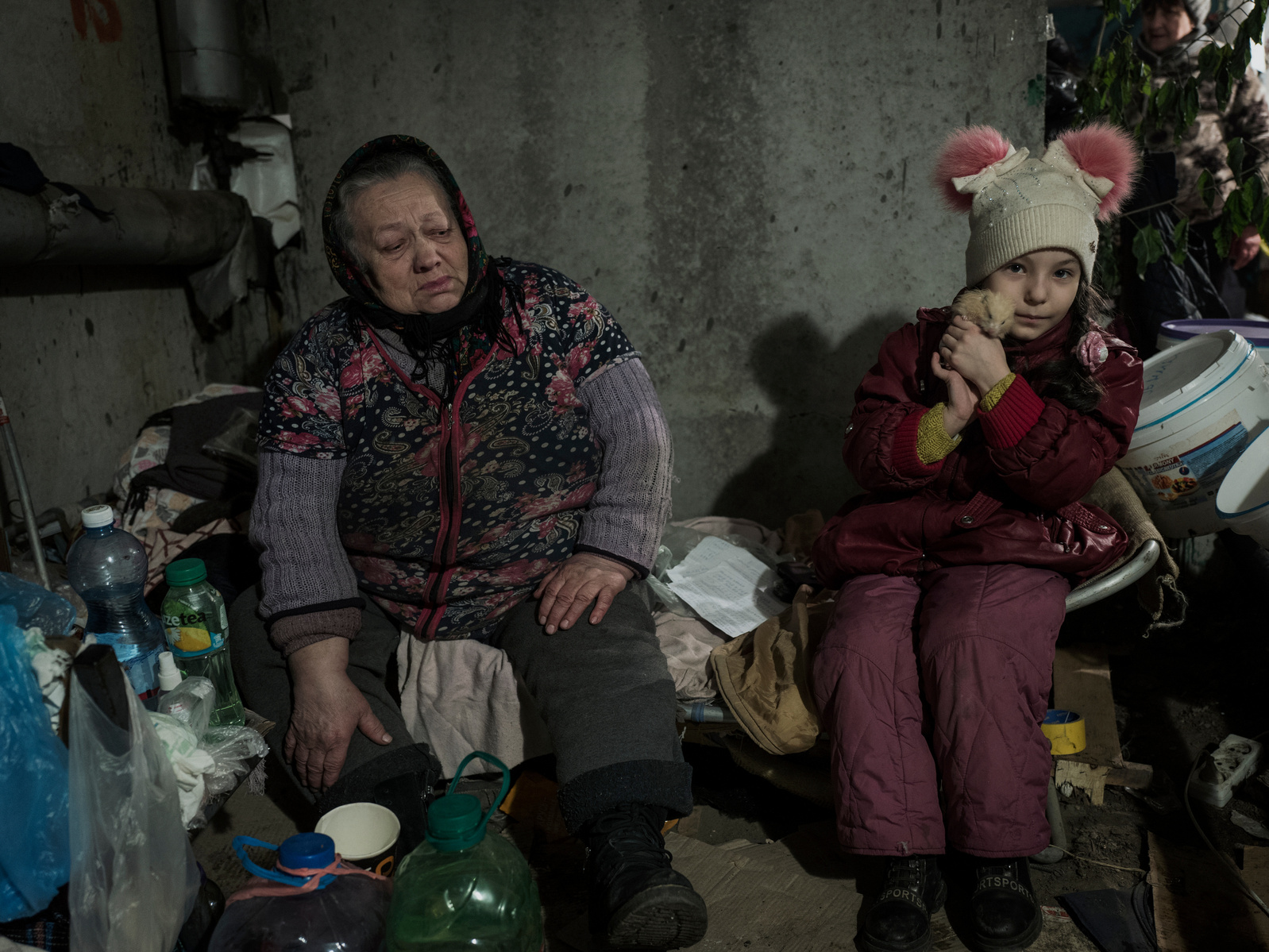 Front line district of Industrialnyi, an eastern suburb of Kharkiv damaged by periodic shelling from Russia army. Resident living in uncomfortable basement of their building since February 25th. 7yo Victoria with her pet. Kharkiv under shelling by Russian