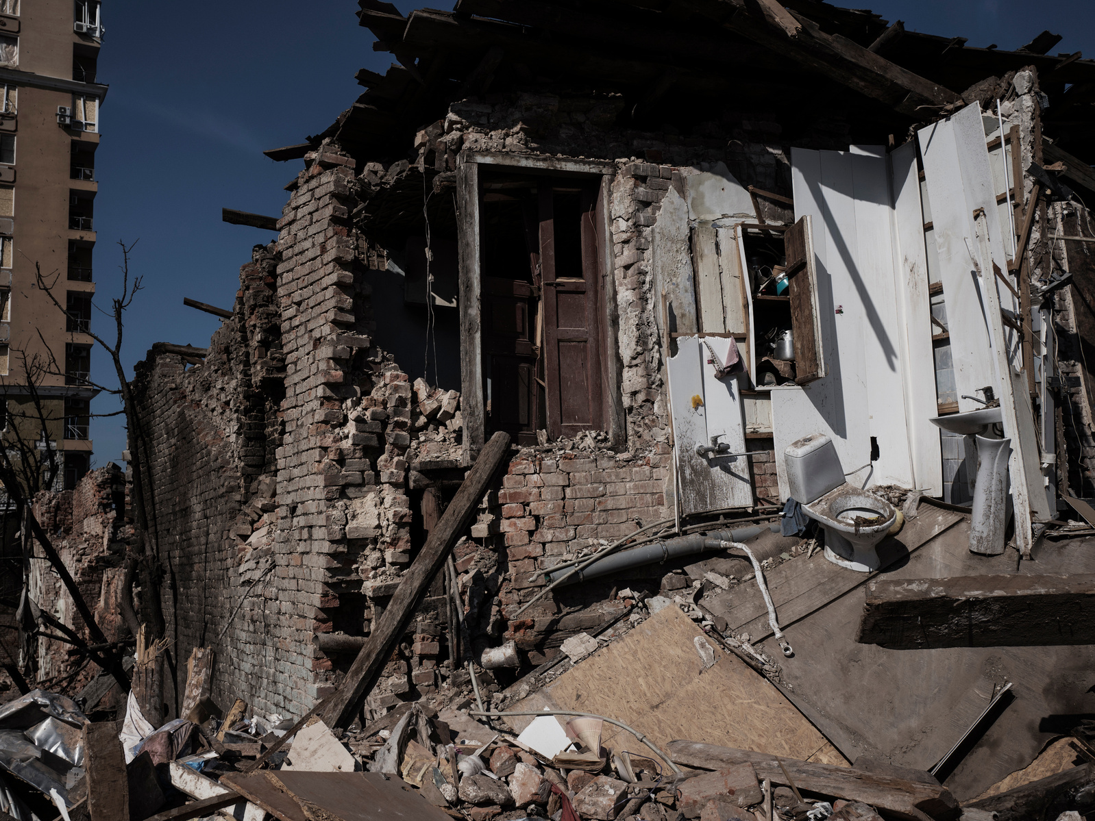 Destroyed house next to the Kharkiv's Court House that was struck by Russian projectiles. Kharkiv under shelling by Russian army, Ukraine. 26 March 2022.