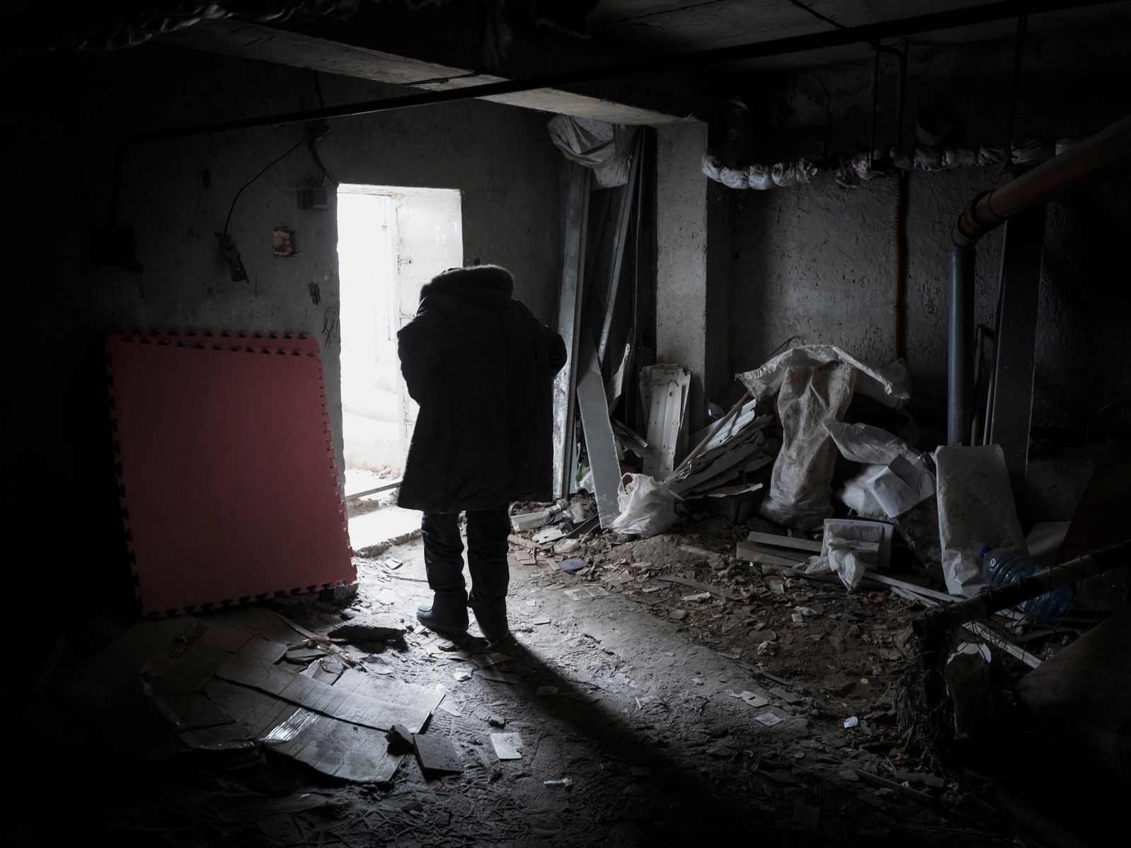 Front line district of Saltivka, a northeastern suburb of Kharkiv, damaged by periodic shelling from Russia army. About thirty residents found shelter in the basement of a damaged schools. The basement has not electricity and cooking is made outside over