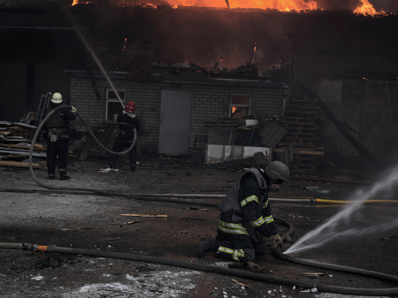 Firefighters battle a blaze that ravage a warehouse after being hit by Russian shelling in Kharkiv. Kharkiv under shelling by Russian army, Ukraine. 28 March 2022.