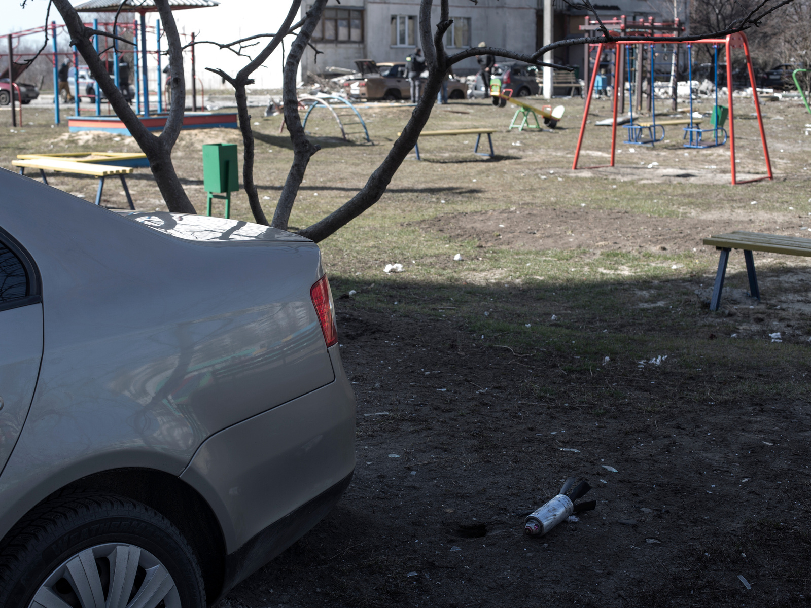 Bomblet from a Russian cluster bomb near a children playground. Front line district of Industrialnyi a eastern suburb of Kharkiv damaged by periodic shelling from Russia army. Kharkiv under shelling by Russian army, Ukraine. 29 March 2022.